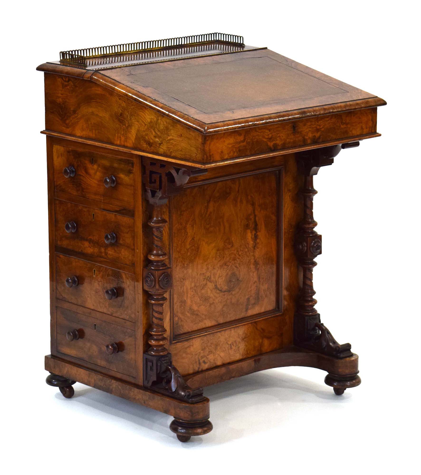 A Victorian figured walnut davenport, the gallery enclosing a letter rack,