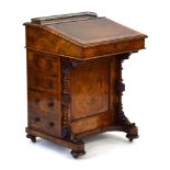A Victorian figured walnut davenport, the gallery enclosing a letter rack,