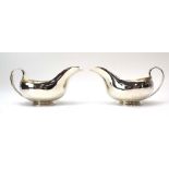 A pair of silver sauce boats of plain traditional form, maker CSG & Co.