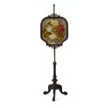 A 19th century mahogany and brass mounted pole screen with an embroidered panel CONDITION