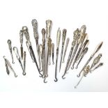 Twenty-five early 20th century and later silver and metalware handled button hooks,