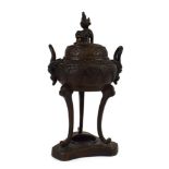 A Chinese brown patinated bronze covered censer of typical form with foo dog finial above a pair of