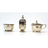 An early 20th century silver three piece cruet set of octagonal form, Mappin & Webb,