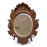 A Continental carved wall mirror,