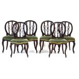 A set of six 19th century mahogany dining chairs, the hoop backs with decorative splats,
