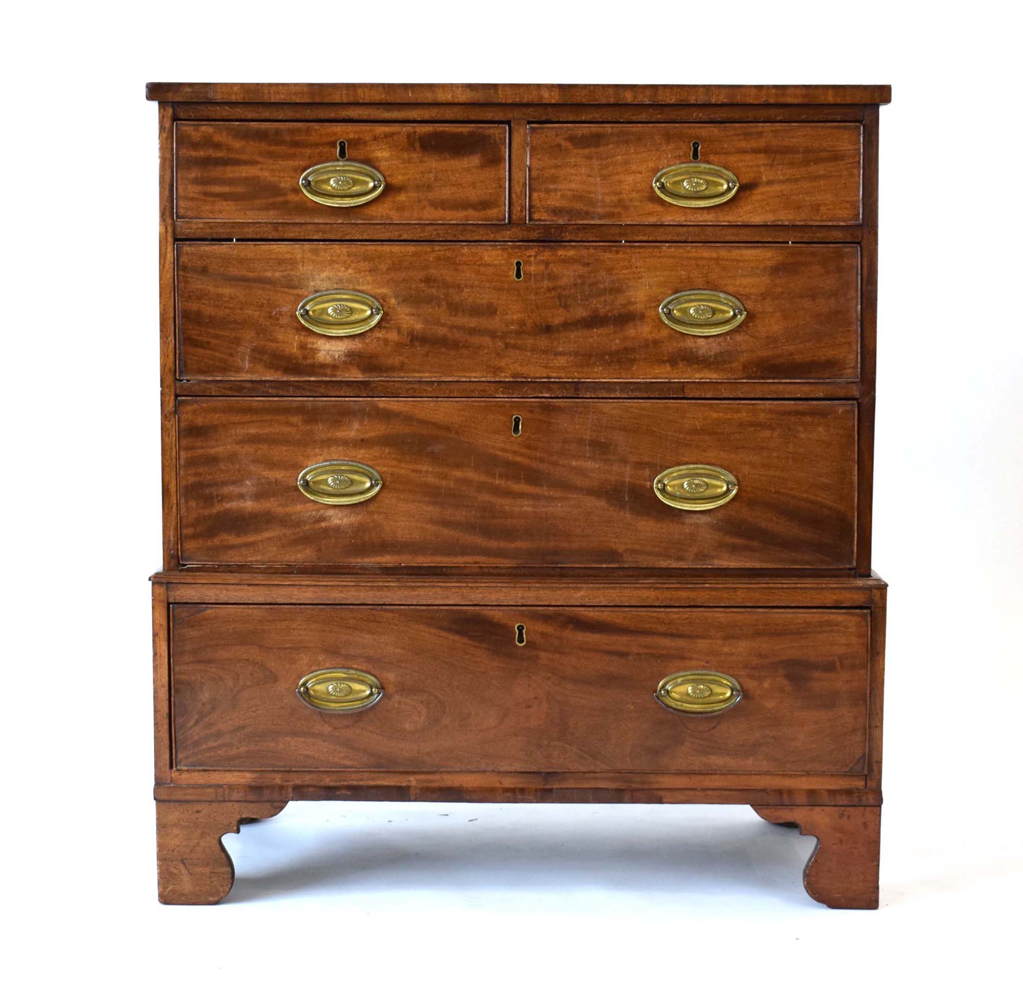 A 19th century mahogany and crossbanded chest-on-chest of low proportions,