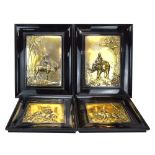 A set of four early 20th century relief decorated metal panels,