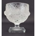 A Lalique frosted and clear glass pedestal vase of ovoid form decorated with finches within laurel