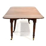 A 19th century mahogany concertina extending dining table with three fitted leaves,