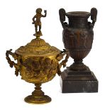 A late 19th century gilt metal twin-handled chalice and cover surmounted by a cherub,