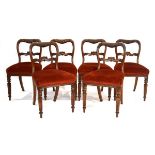 A set of six Victorian mahogany and upholstered dining chairs on turned front legs