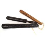 An Irish bog oak truncheon together with two further turned truncheons (3)