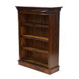 A late Victorian mahogany open-fronted bookcase on a plinth base, w.