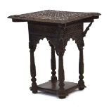 An Anglo-Indian two-tier occasional table with intricate carving, w.