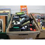 Crate containing model die cast vehicles, many on stands