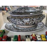 Decorative ceramic tureen on platter