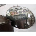 Unframed oval bevelled wall mirror