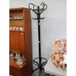 Free standing black metal hat and coat stand