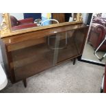 (2150) Mid century glazed display cabinet with siding doors