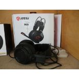 (2562) Boxed pair of MSI gaming headphones with unboxed pair