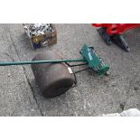 Old style steel lawn mower with newer model garden aerator