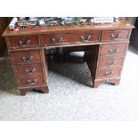 Mahogany effect twin pedestal office desk with green leather surface