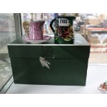 Box containing childrens tea service and small green jug