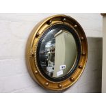 Circular gilt framed convex wall mirror