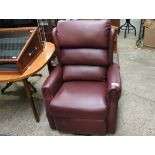 Red leather upholstered reclining easy chair