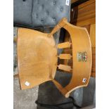 Wooden chair baring printed crest