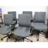 5 dark grey upholstered vitra swivel office armchairs