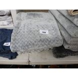 2 patterned grey throws