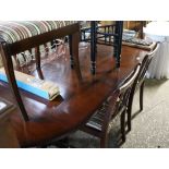 Reproduction mahogany extending dining table with 6 matching striped upholstered dining chairs (4+2)