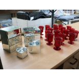 Set of 4 mirrored jewellery boxes and approx. 19 red glass candle holders