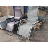 Pair of silver and black mesh seated garden reclining sun loungers