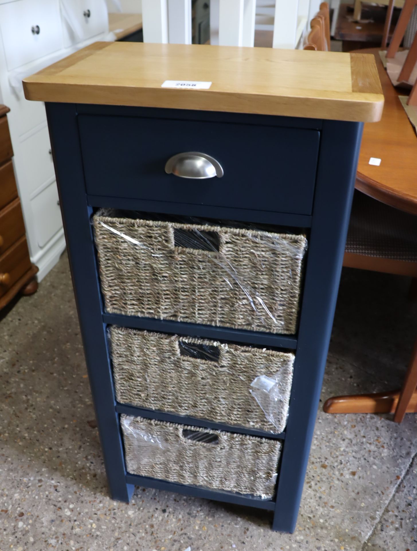 Dark blue storage unit with single drawer, 3 further rattan drawers and oak surface