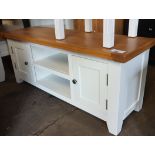 Off-white entertainment stand with 2 small cupboards and oak surface