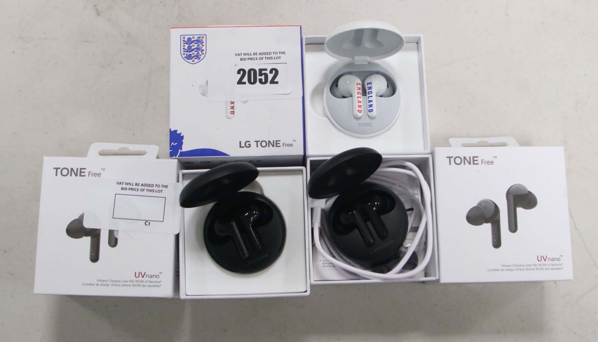 3 boxed sets of LG Tone Free wireless earbuds