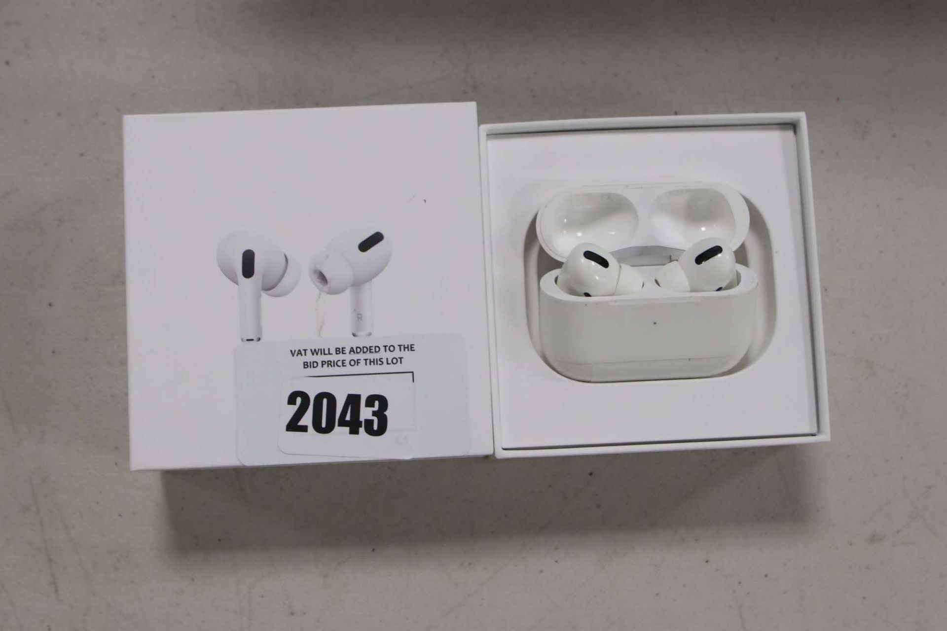 Apple AirPods Pro with wireless charging case and box