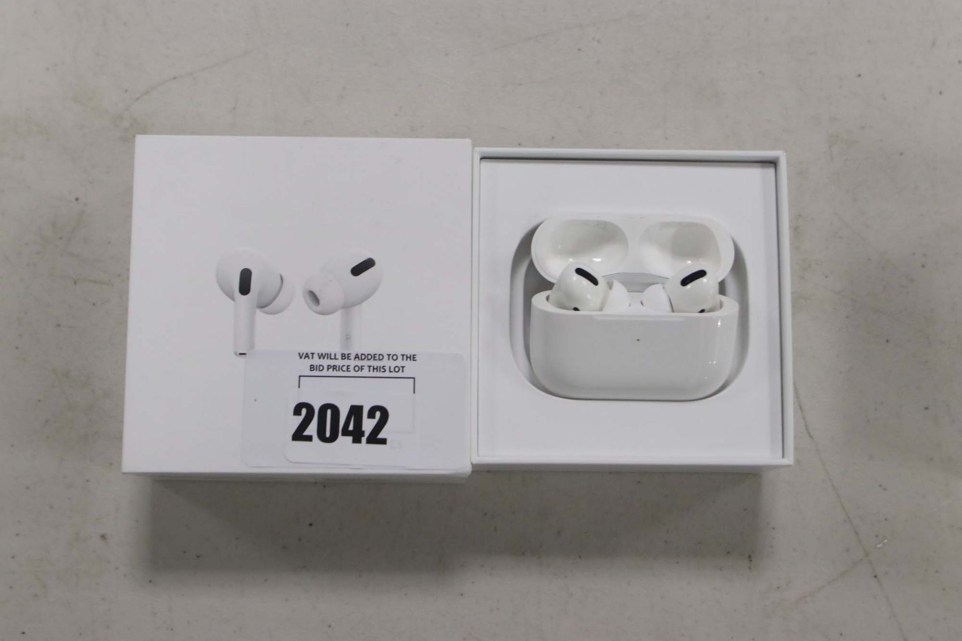 Apple AirPods Pro with wireless charging case and box