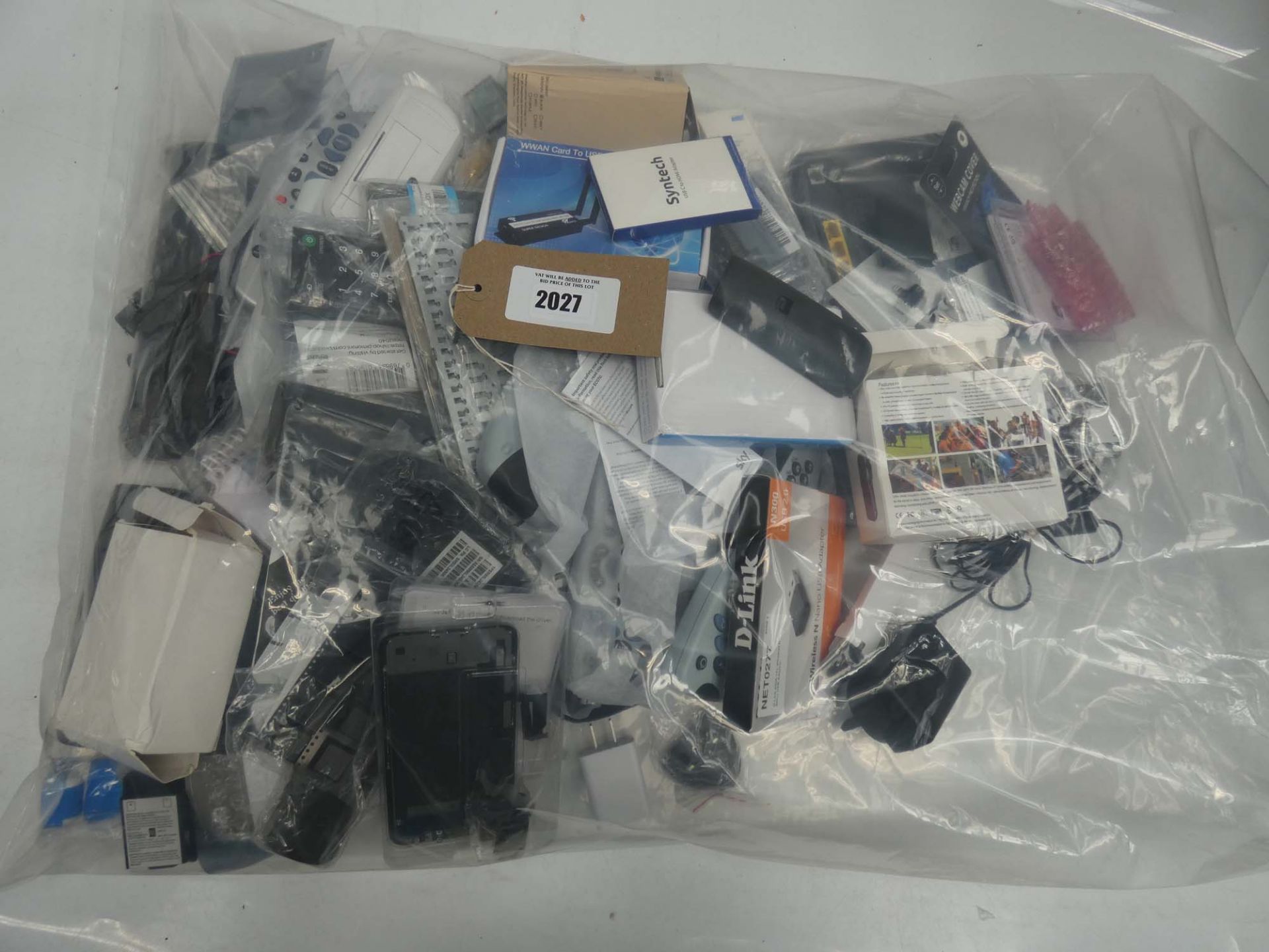 Bag of remote controls, WWAN cards and IT spares