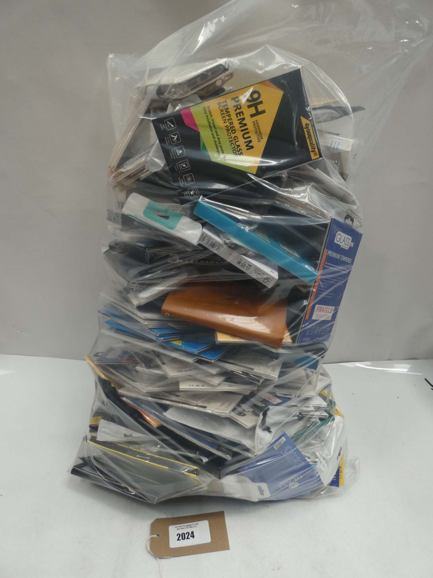 Bag containing large quantity of mobile cases and covers