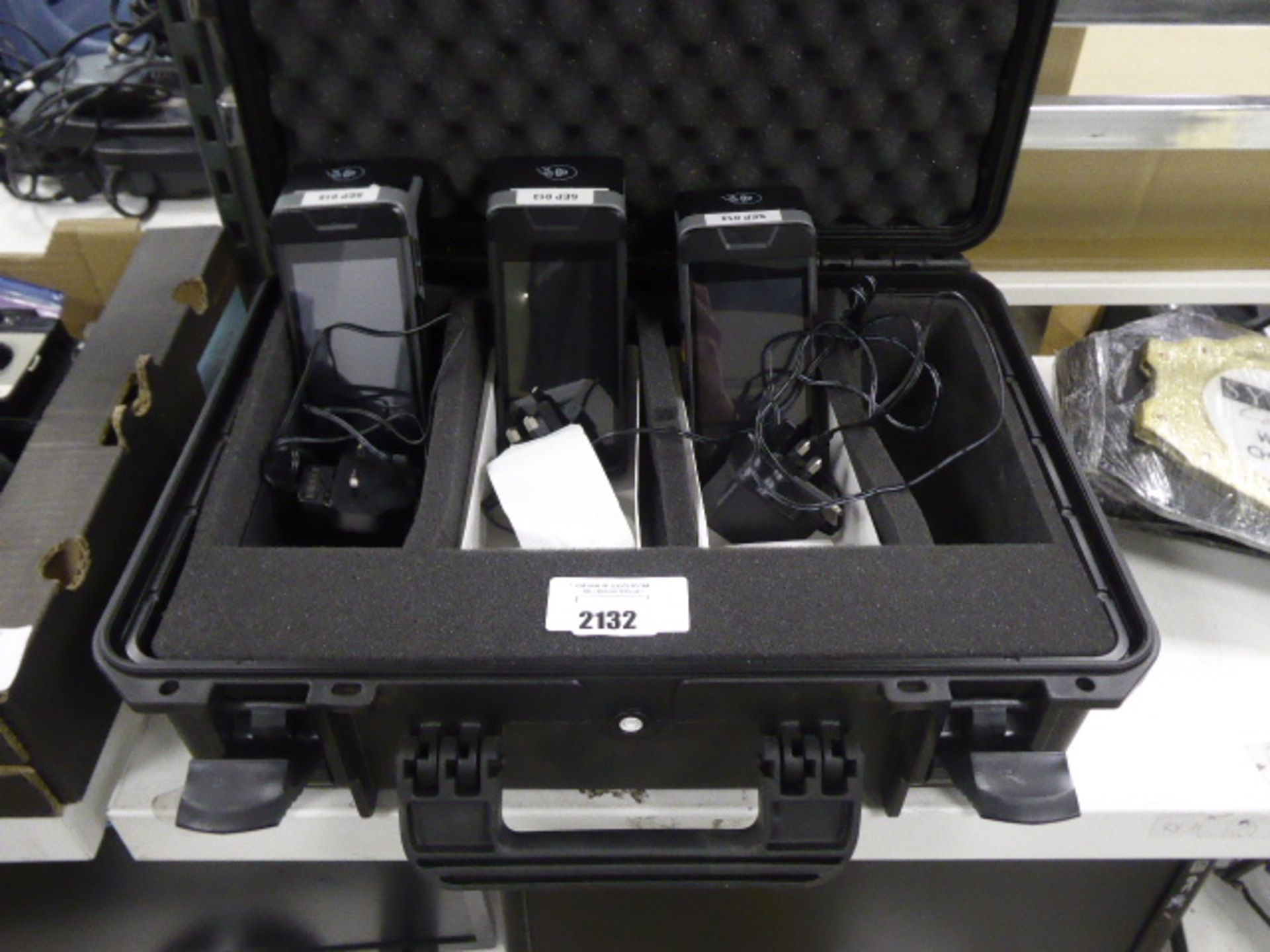 Three wireless touchscreen payment terminals with chargers and carry case