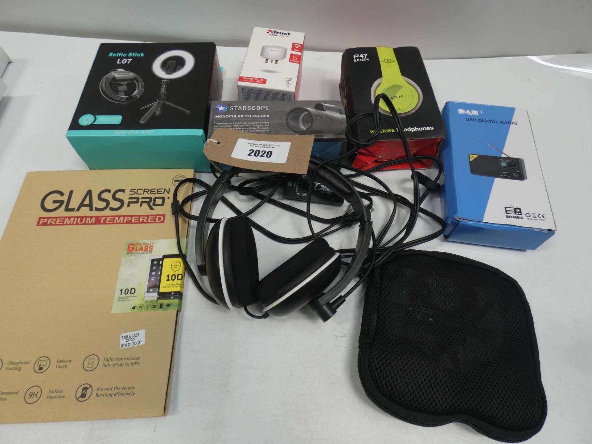 Bag containing headsets, headphones, selfie light, DAB radio, monocular scope