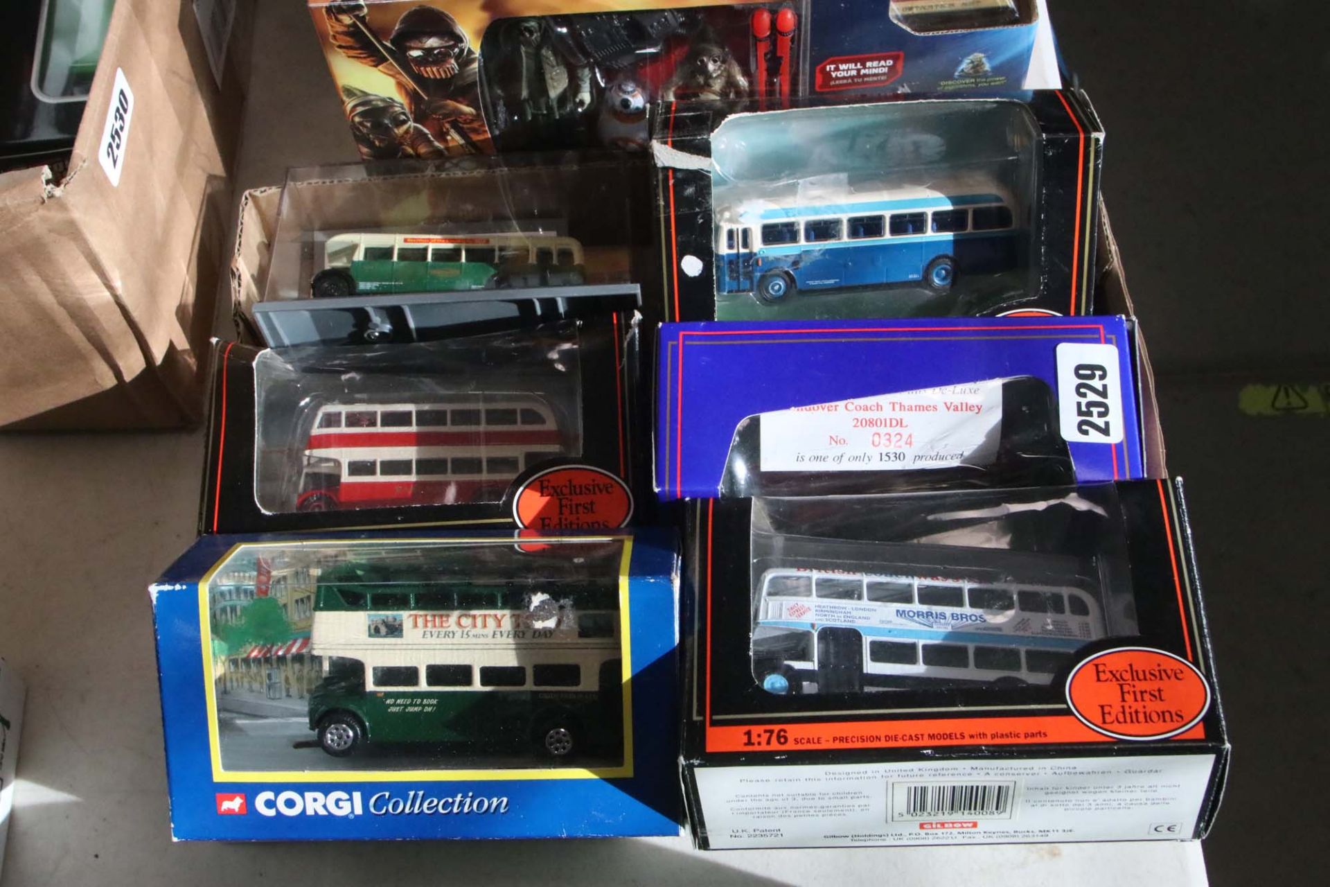 6 various die cast collectible buses in boxes