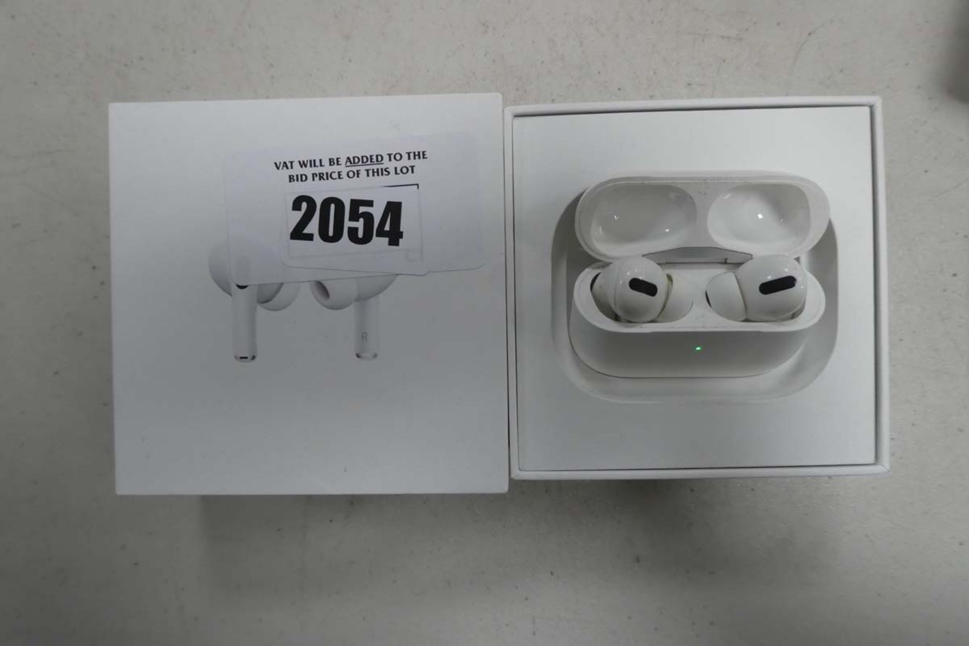 Apple AirPods Pro with wireless charging case and box