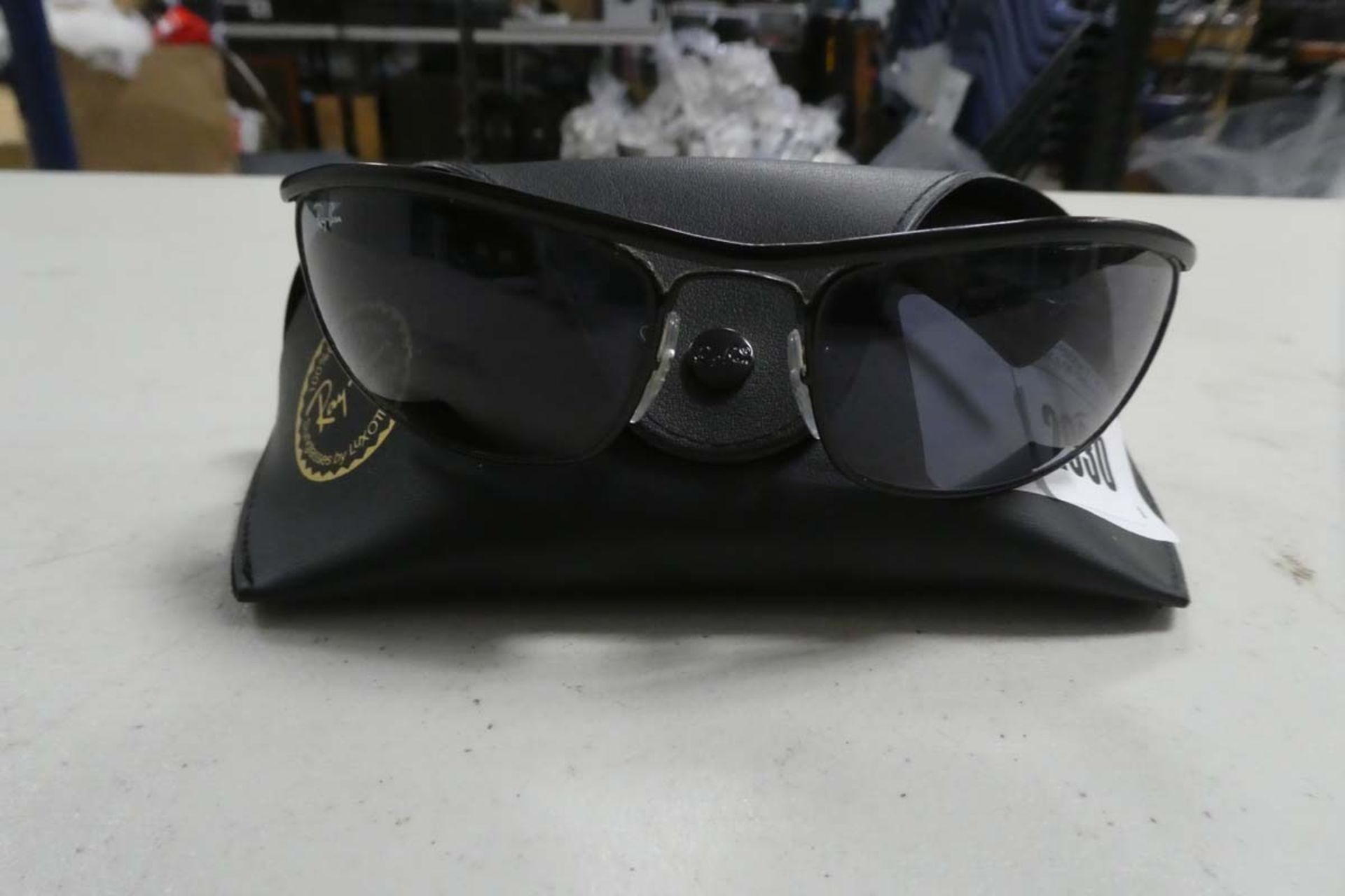 Ray-Ban sunglasses model RB3119 with hard case