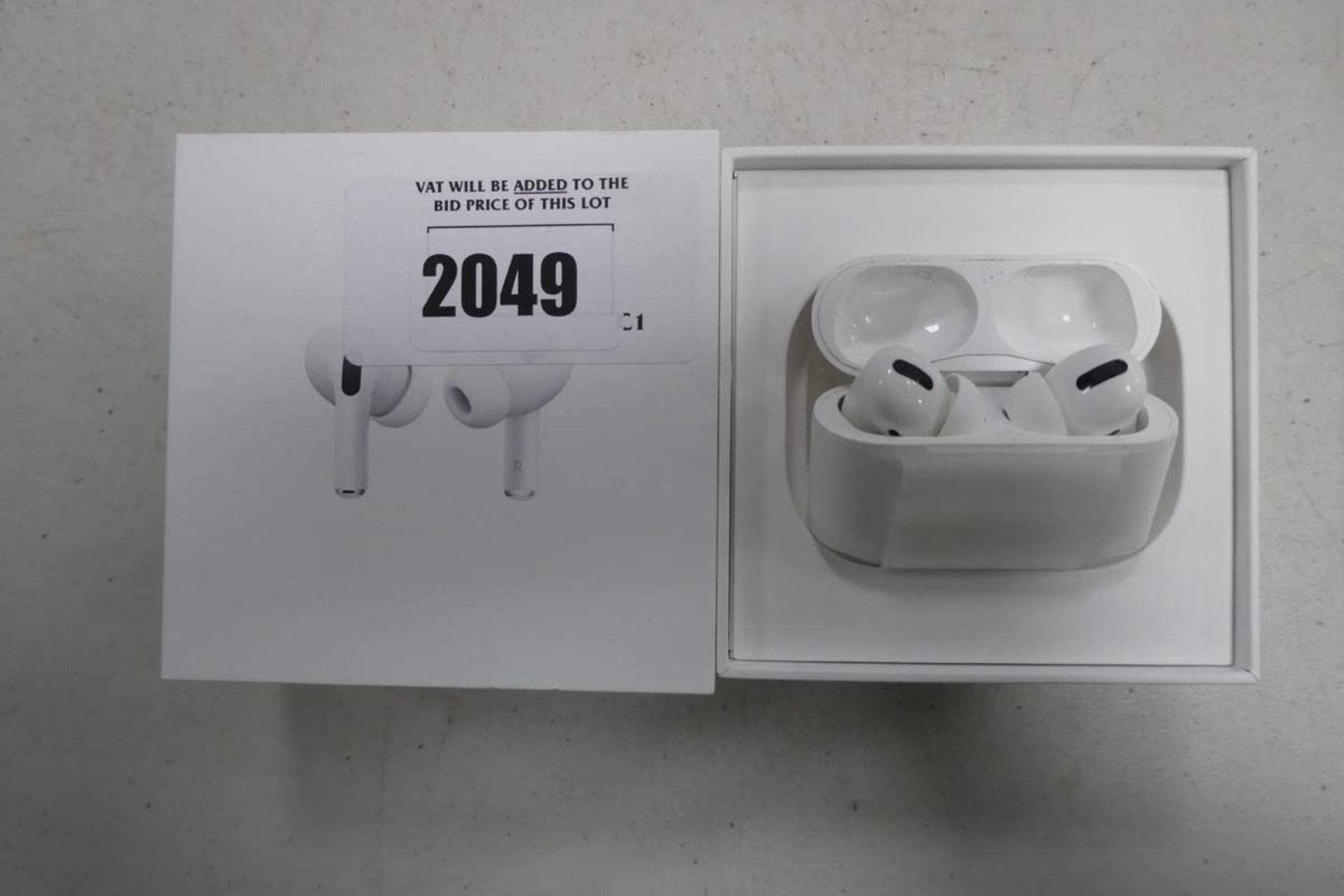 Apple AirPods Pro with wireless charging case and box