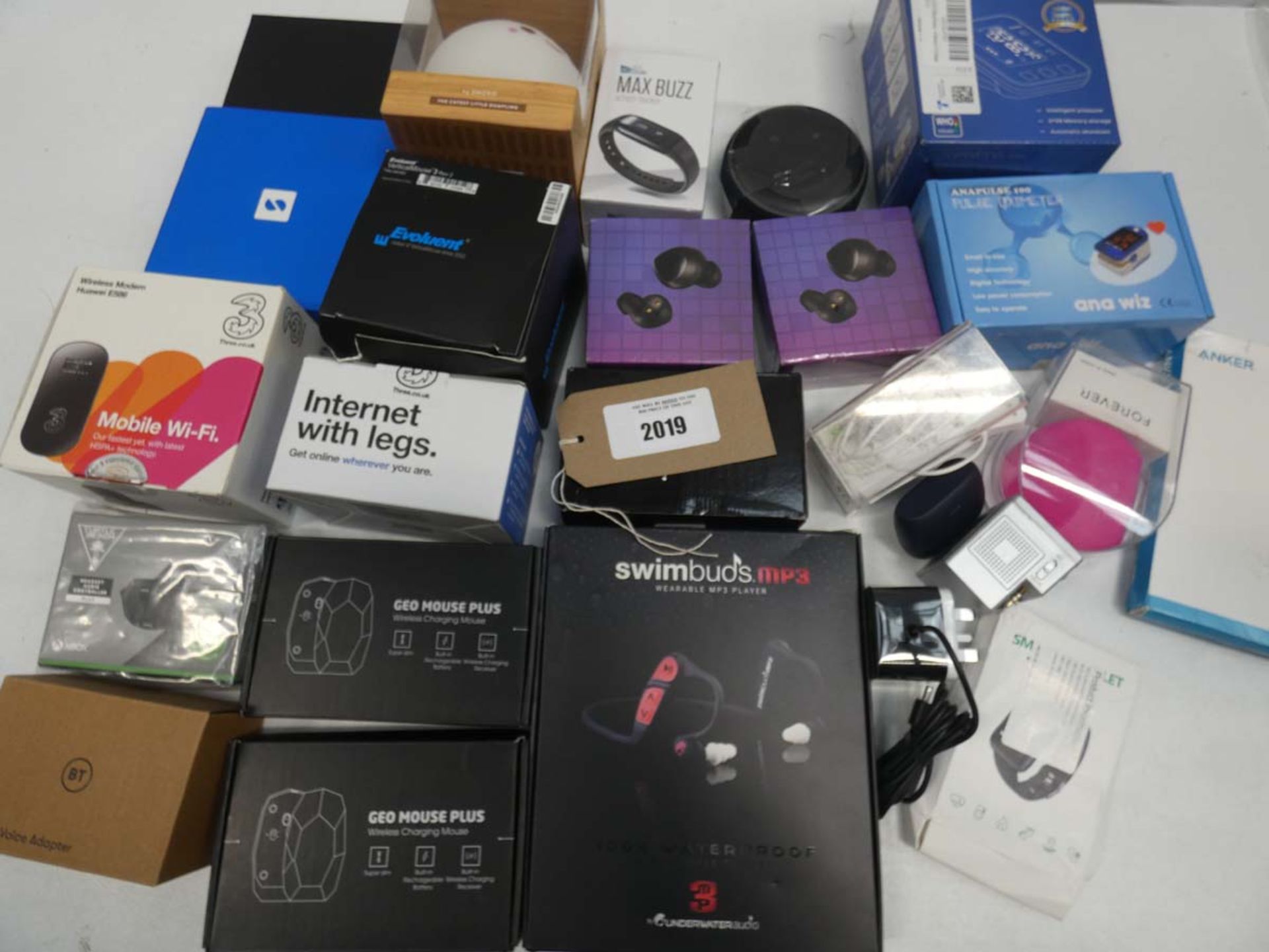 Bag containing wireless earphones, PC mice, blood pressure monitor, oximeter, mobile WiFi, SumUp