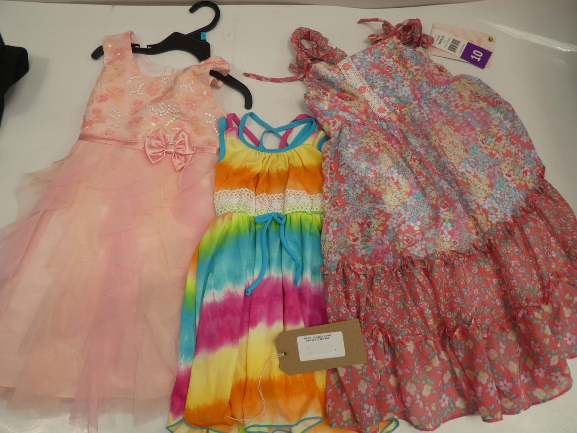 Three Jona Michelle dresses in various styles, for ages 3,4 and 10